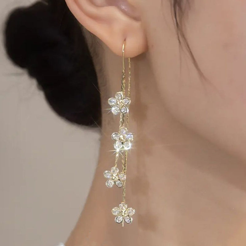 Örhängen med zirkon plommonblomma