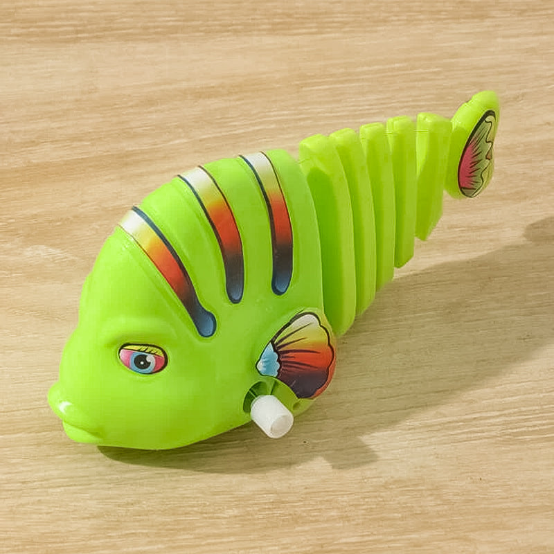 Clockwork svängande tecknad fisk leksaker