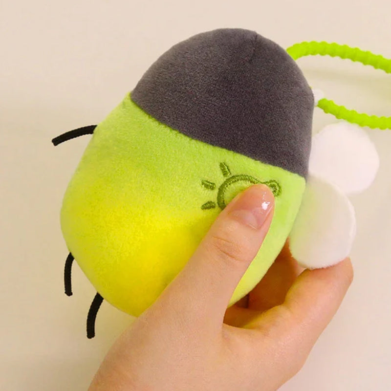 Interaktiv glödmask-plush nyckelhänge