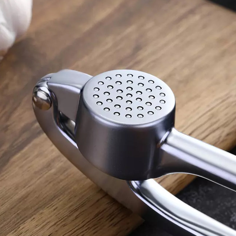 Vitlökspress med ergonomiskt handtag